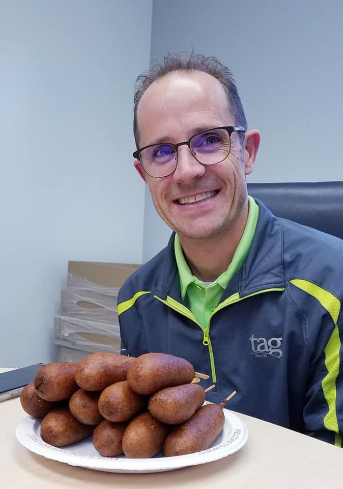 Before shot of CEO Sean Francis on TAG’s Annual Corndog Day