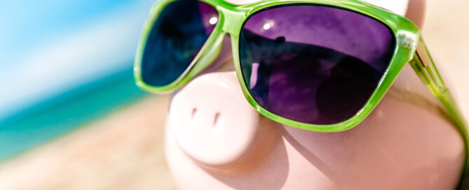 Piggy bank in sunglasses showing the hidden costs of cheap IT support services.