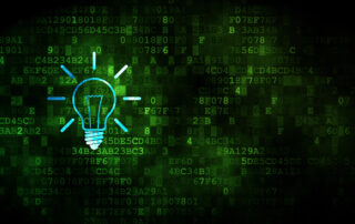 Green tech background with illuminated lightbulb symbolizing a proactive IT support company.